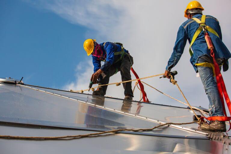 A certified VertiGleam technician with their safety gear